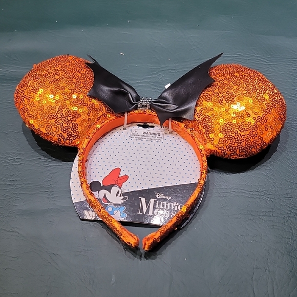 Disney Other - **Disney Sparkling Orange Minnie Ears with Black Bow**